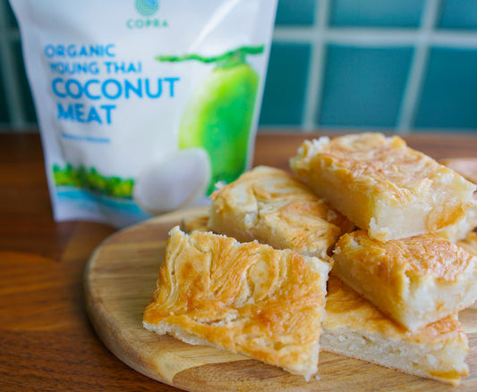 young Thai coconut meat cake drizzled with organic coconut nectar