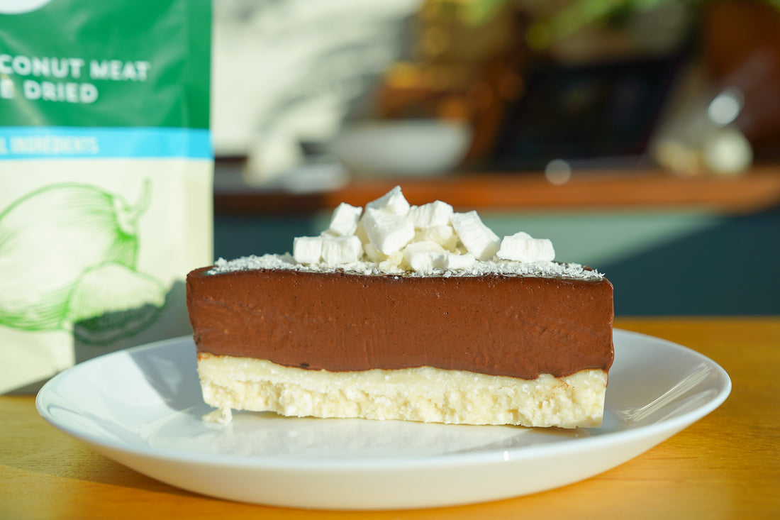 Dark chocolate and coconut no-bake vegan tart made with copra's freeze dried coconut meat
